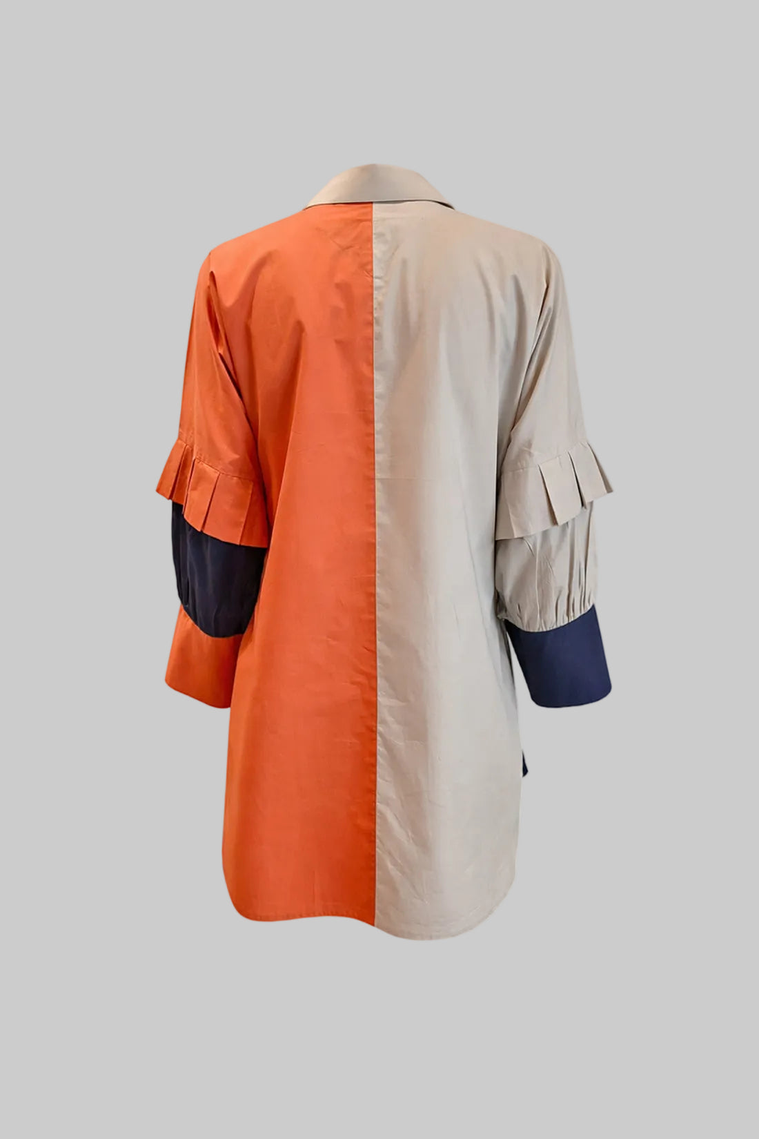 Color-blocked shirt with orange, beige, and blue sections on a white background