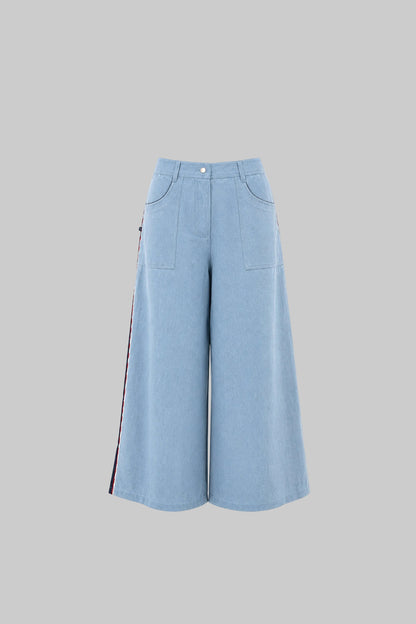 Light blue wide-leg pants on a light gray background