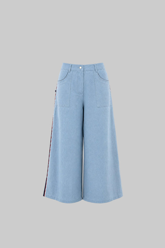 Light blue wide-leg pants on a light gray background