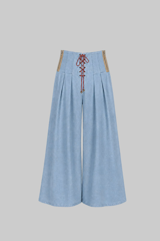 Light blue wide-leg pants with lace-up front on a light gray background