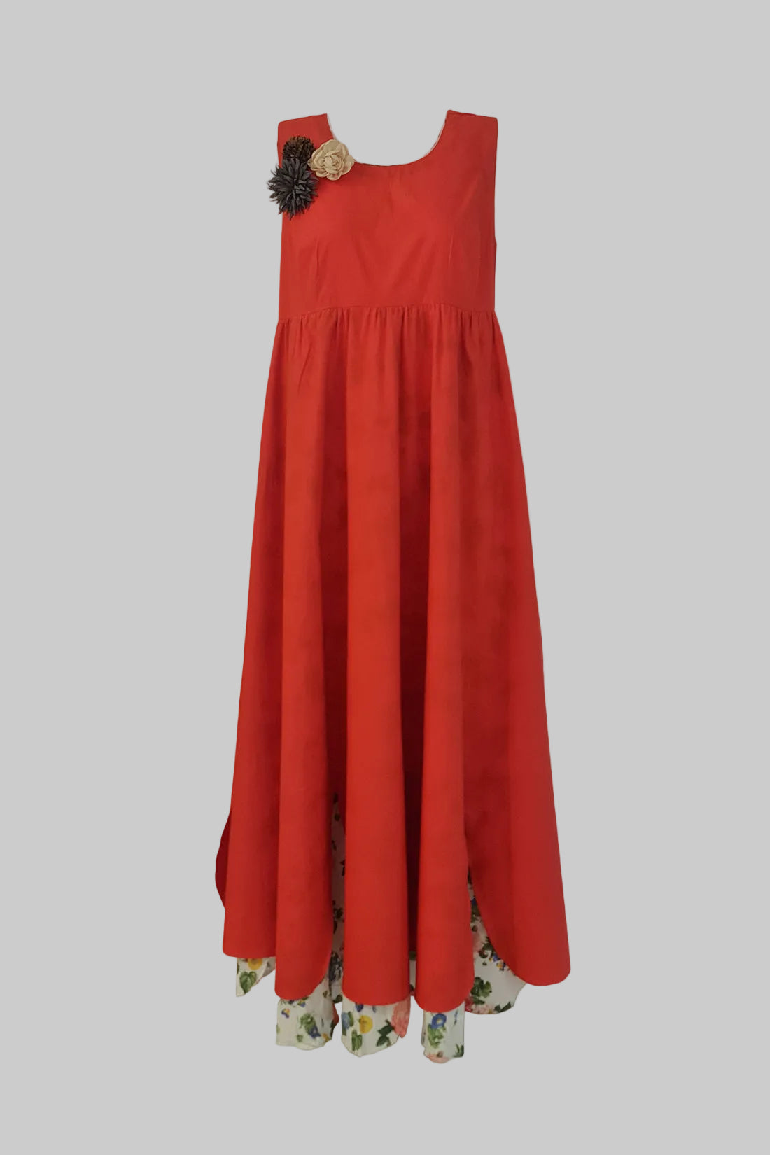 Red dress with floral hem on a gray background