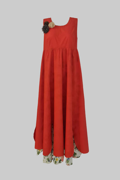 Red dress with floral hem on a gray background