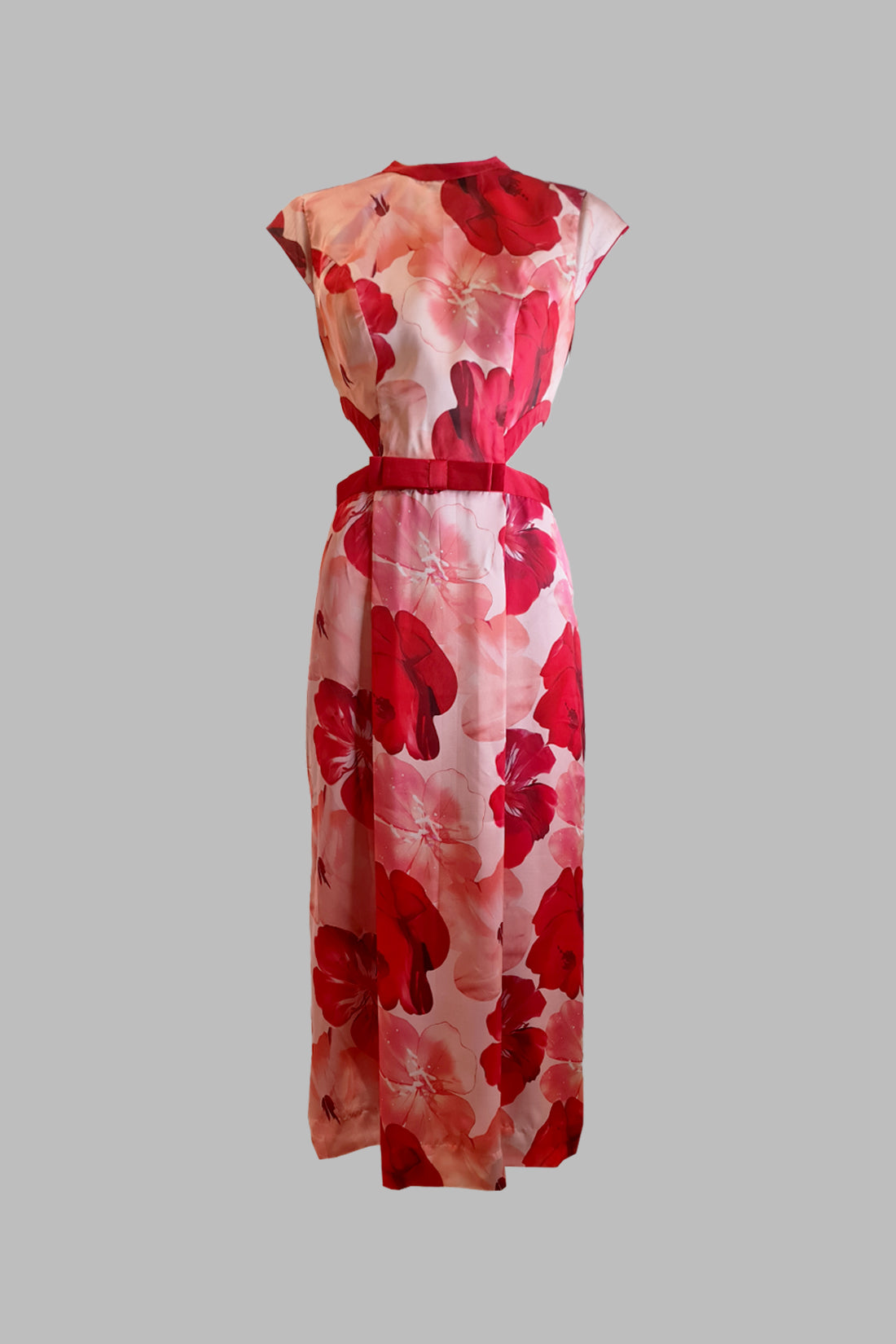 Red and pink floral dress on a gray background