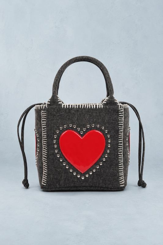 Handbag with a red heart design on a light blue background