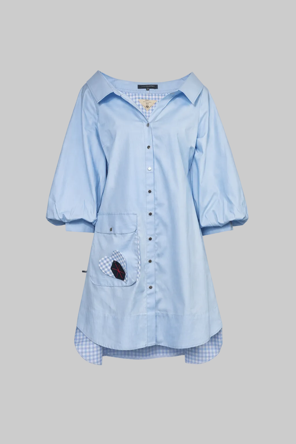 Light blue shirt with a pocket detail on a white background