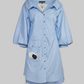 Light blue striped shirt dress on a light gray background