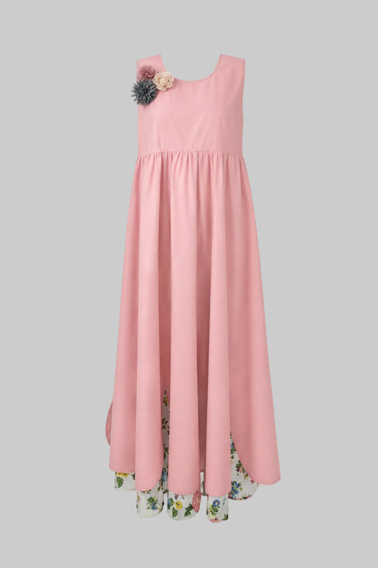 Pink dress with floral details on a gray background