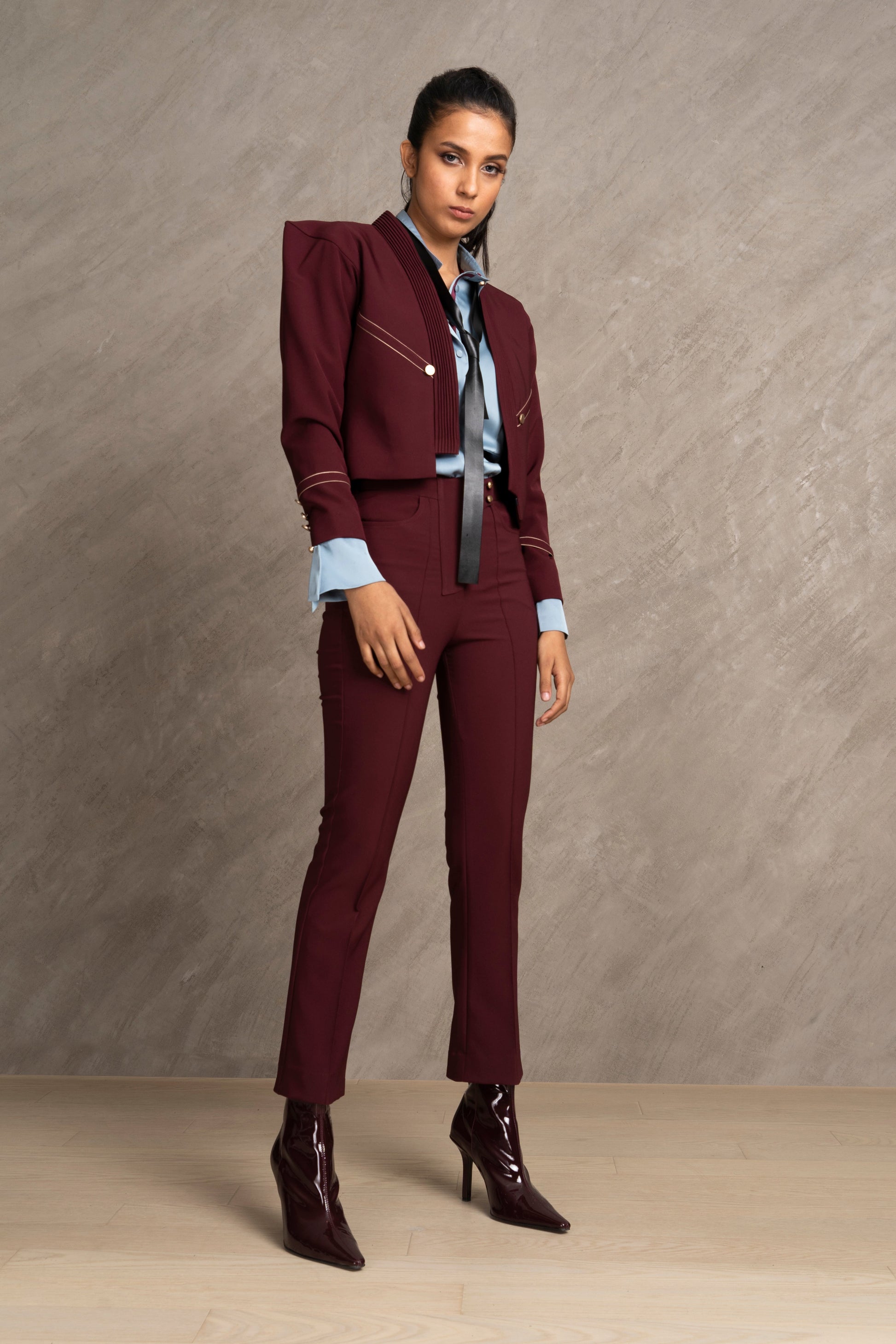 Woman wearing a burgundy suit 