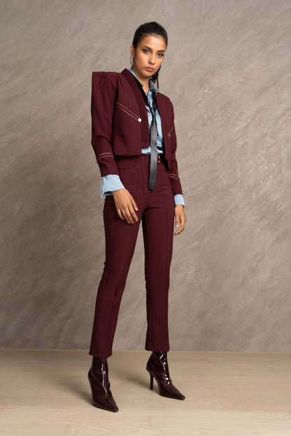 Woman wearing a burgundy suit 