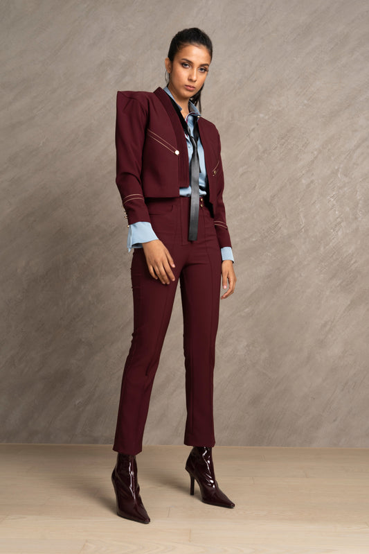 Woman wearing a burgundy suit 